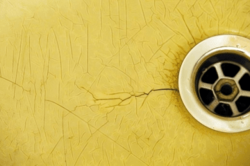 The image shows Crack in a plastic bathtub