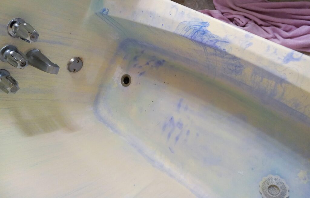 The image show a temporary hair dye stains in a bathtub.