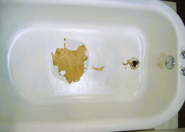 The image show a peeling bathtub.