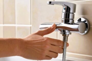 The image shows a shower faucet handle.