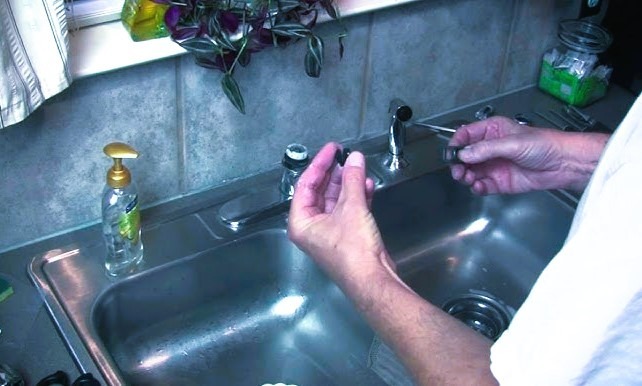 THE image shows the component of kitchen sink faucet.
