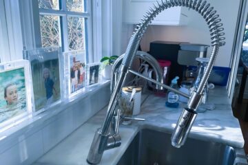 The image shows a loose kitchen sink faucets.