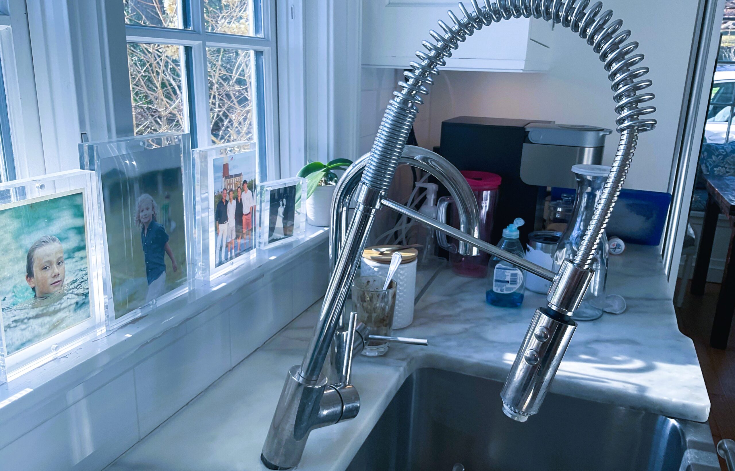 The image shows a loose kitchen sink faucets.